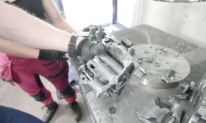 Crushing Tractor Engine Head with 300 Ton Hydraulic Press