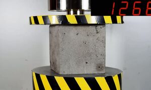 HYDRAULIC PRESS AGAINST CONCRETE OF DIFFERENT AGES